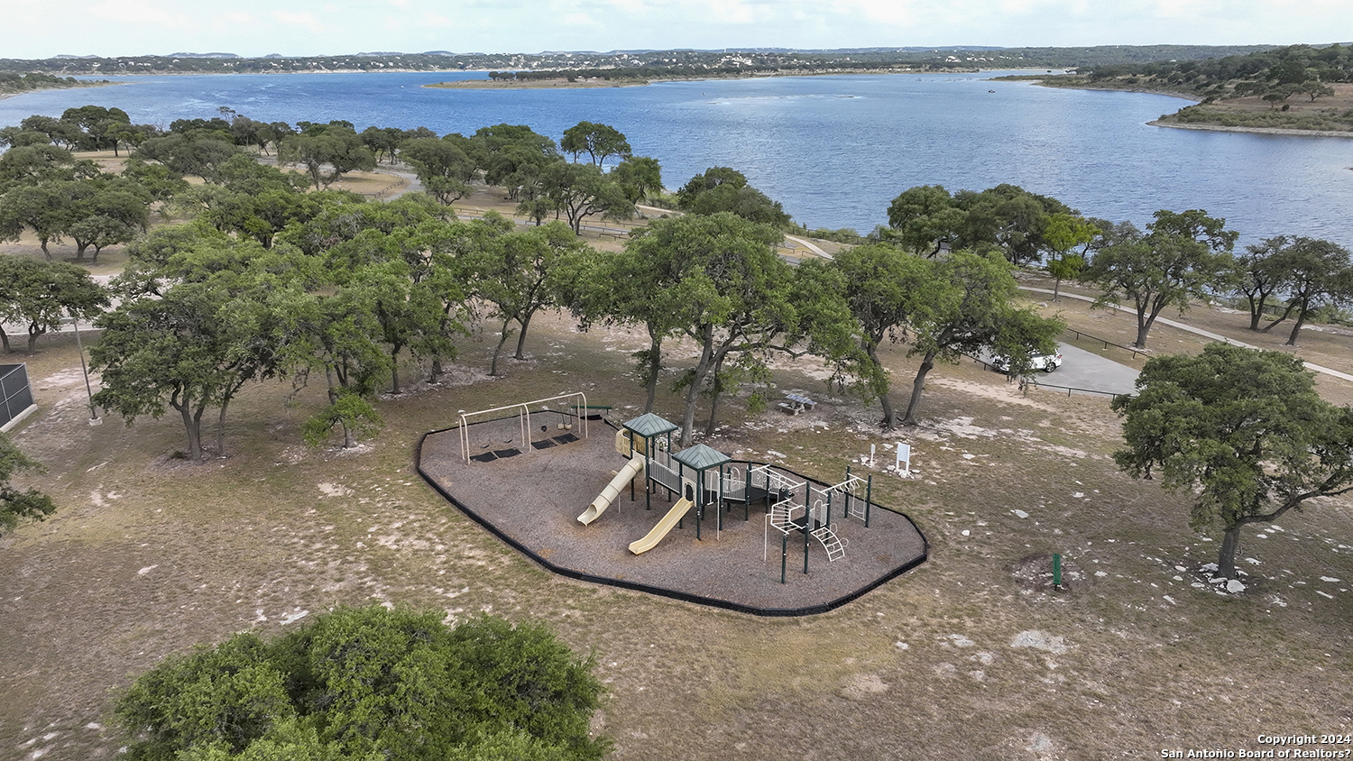 149 Alondra Lane Spring Branch, TX 78070 - Photo 45 of 46 an aerial view of a house with outdoor space and lake view