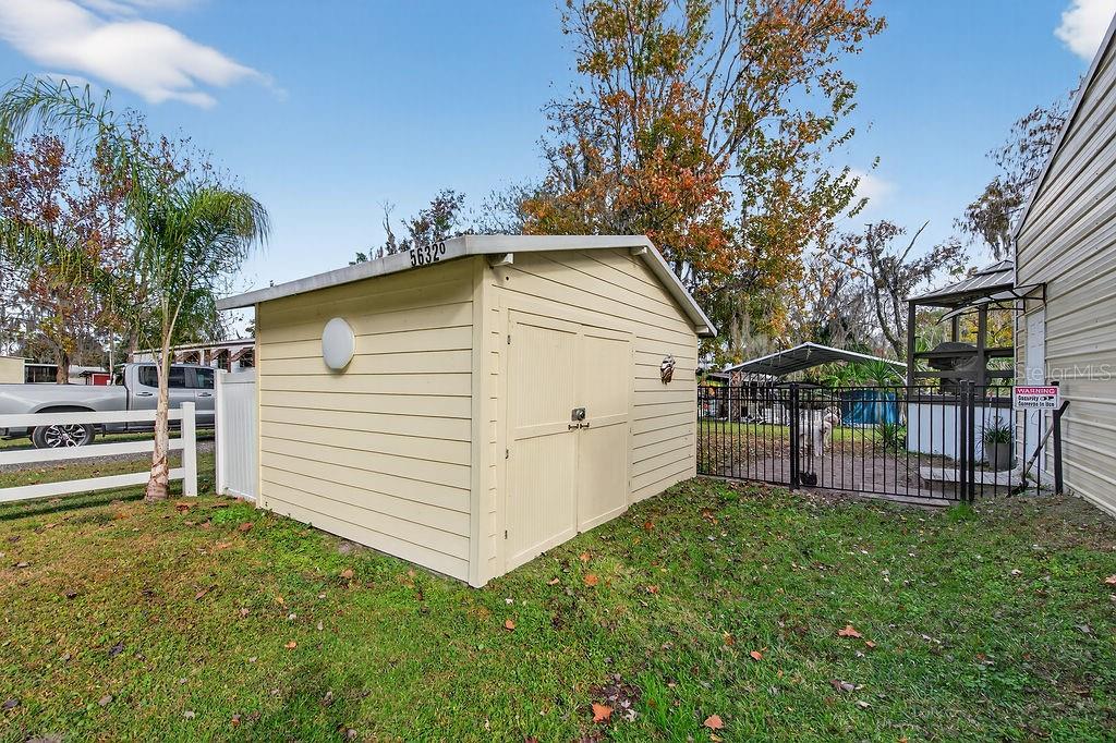 56320 Cherry Tree Road Astor, FL 32102 - Photo 17 of 40 a view of a house with a yard