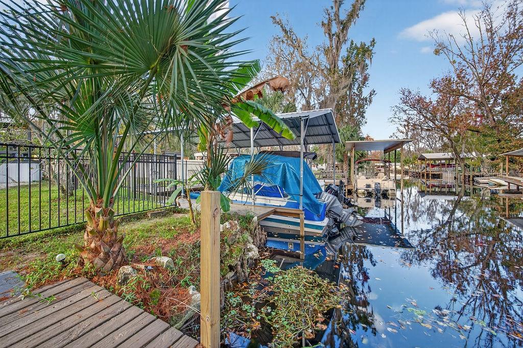 56320 Cherry Tree Road Astor, FL 32102 - Photo 23 of 40 a view of a yard with plants and large trees