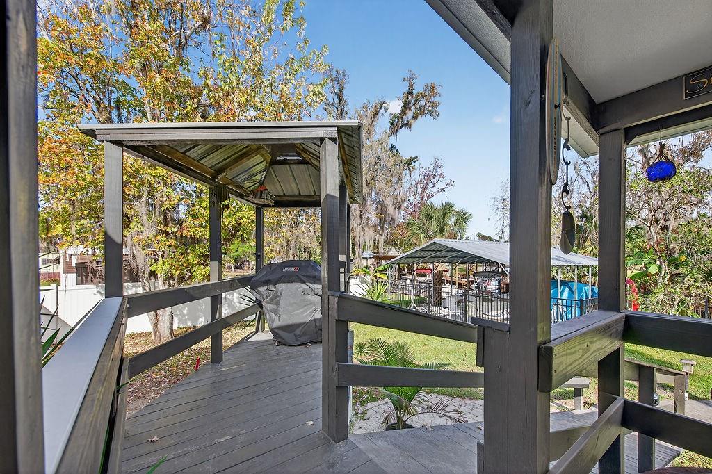 56320 Cherry Tree Road Astor, FL 32102 - Photo 25 of 40 a view of an outdoor space with seating