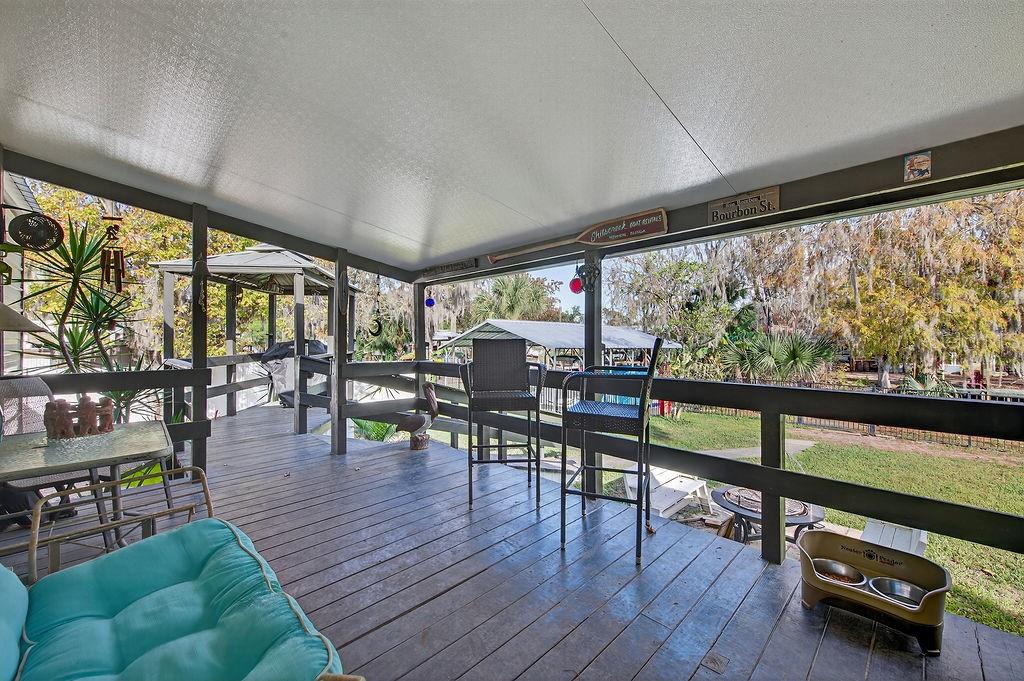 56320 Cherry Tree Road Astor, FL 32102 - Photo 26 of 40 a living room with furniture and a large window