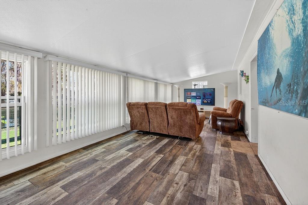 56320 Cherry Tree Road Astor, FL 32102 - Photo 31 of 40 a living room with furniture window and wooden floor