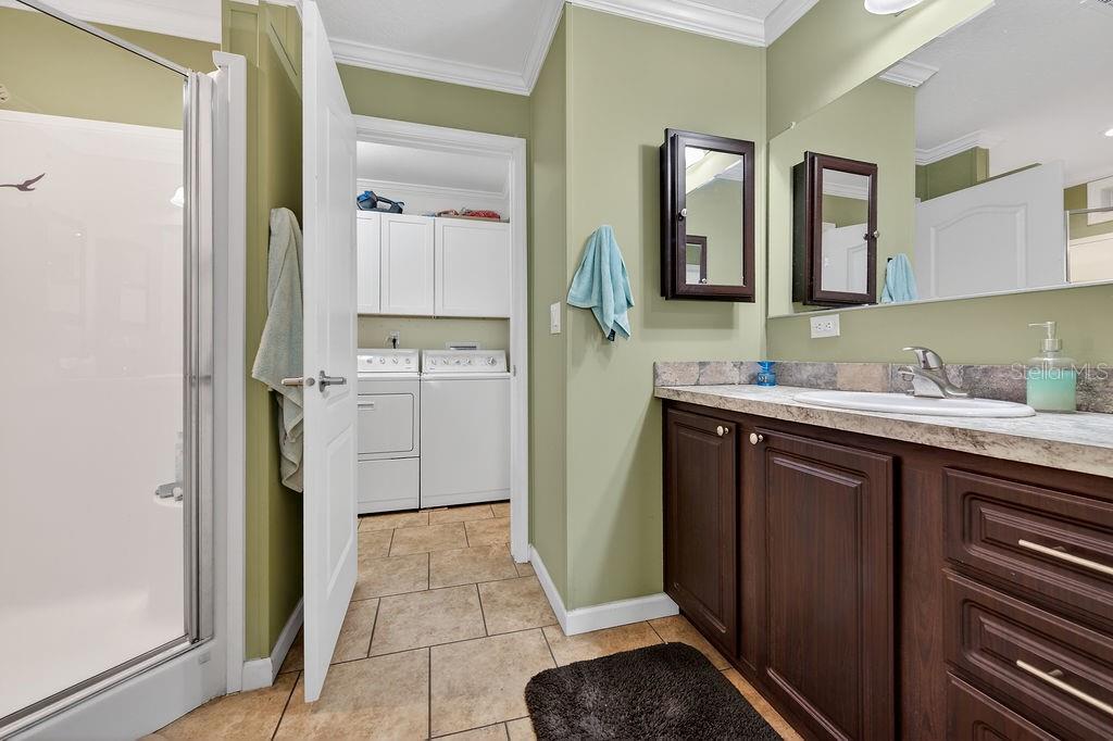 56320 Cherry Tree Road Astor, FL 32102 - Photo 33 of 40 a bathroom with a sink and a mirror