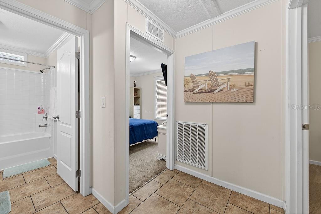 56320 Cherry Tree Road Astor, FL 32102 - Photo 35 of 40 a view of a hallway with closet and a window