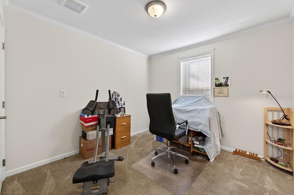 56320 Cherry Tree Road Astor, FL 32102 - Photo 36 of 40 a view of a workspace with furniture and a window