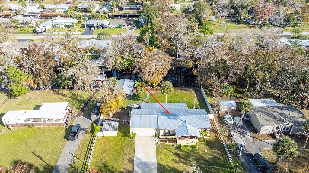 56320 Cherry Tree Road Astor, FL 32102 - Photo 4 of 40 an aerial view of a house with a yard and lake view