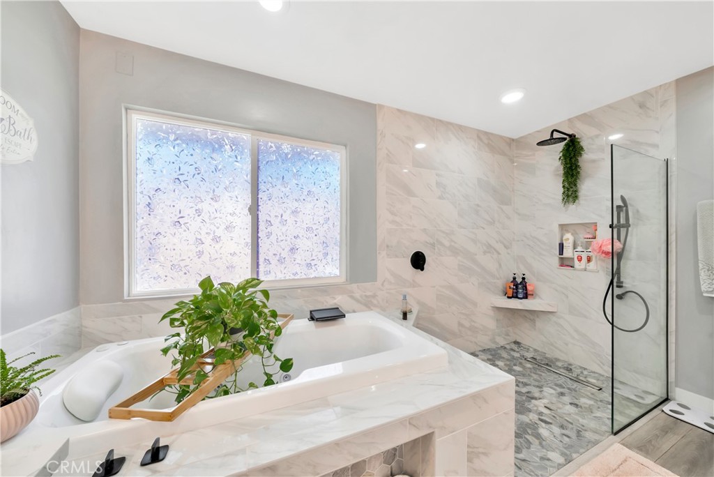 1543 East Fairway Drive Orange, CA 92866 - Photo 26 of 49 a bath tub sitting in a bathroom next to a window