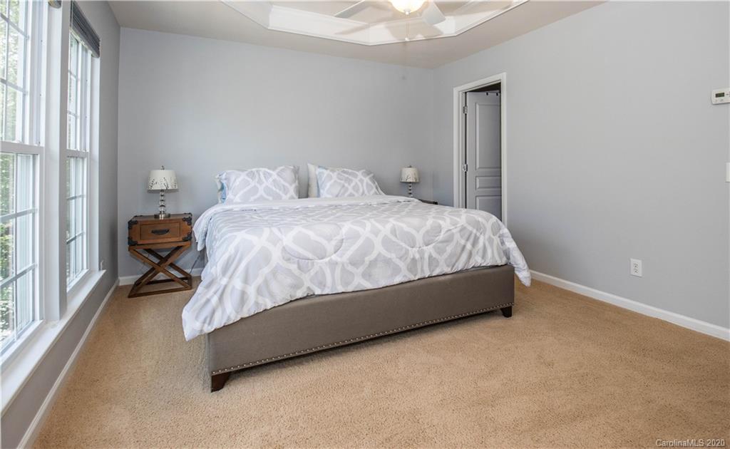 1068 Drayton Court Fort Mill, SC 29708 - Photo 14 of 37 a bed sitting in a bedroom next to a window