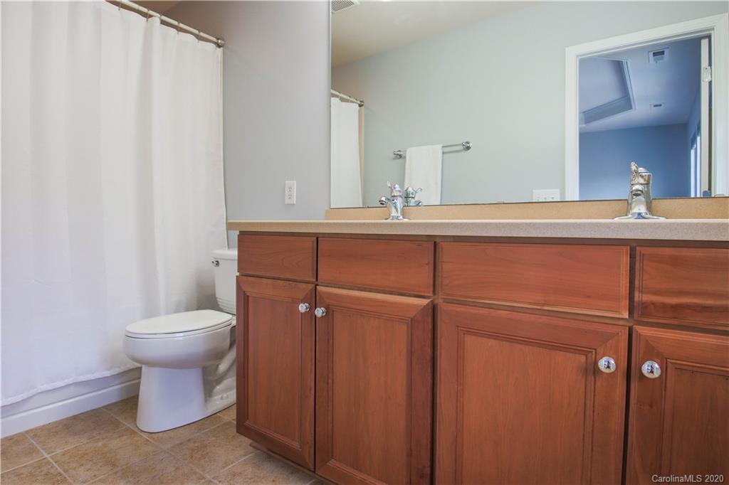 1068 Drayton Court Fort Mill, SC 29708 - Photo 15 of 37 a bathroom with a sink a toilet and mirror