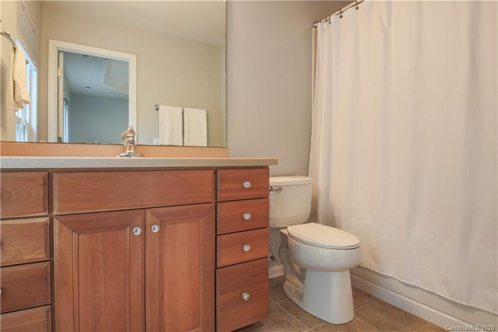1068 Drayton Court Fort Mill, SC 29708 - Photo 17 of 37 a bathroom with a toilet a sink and mirror