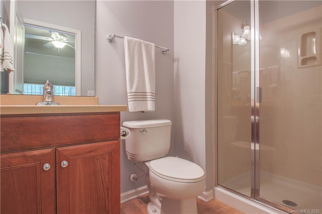 1068 Drayton Court Fort Mill, SC 29708 - Photo 19 of 37 a bathroom with a sink a toilet and shower