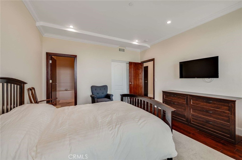 11837 Rideout Way Whittier, CA 90601 - Photo 18 of 44 a bedroom with a bed and a flat screen tv