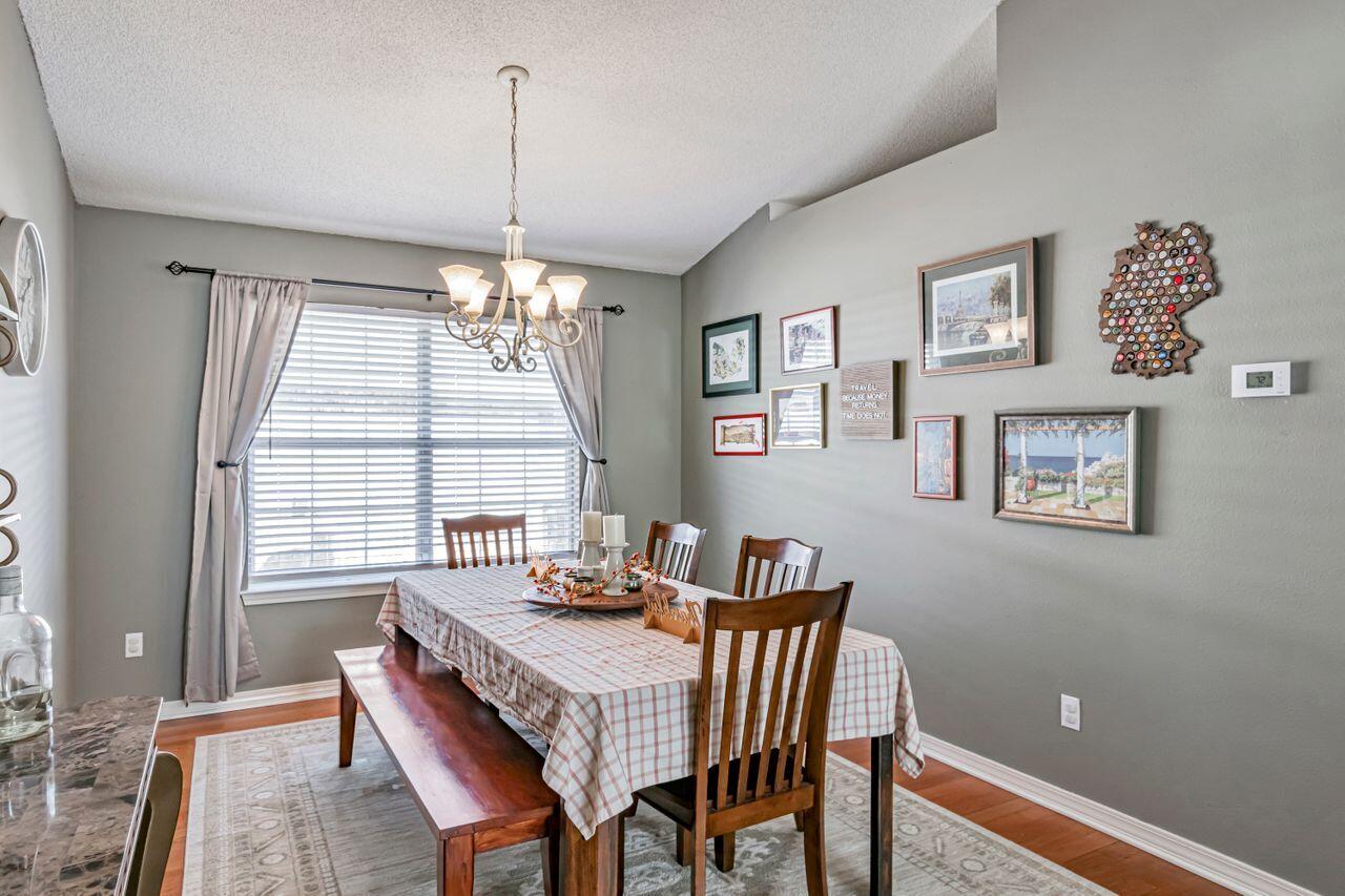 9761 Leeward Way Navarre, FL 32566 - Photo 17 of 43 a view of a dining room with furniture window and outside view