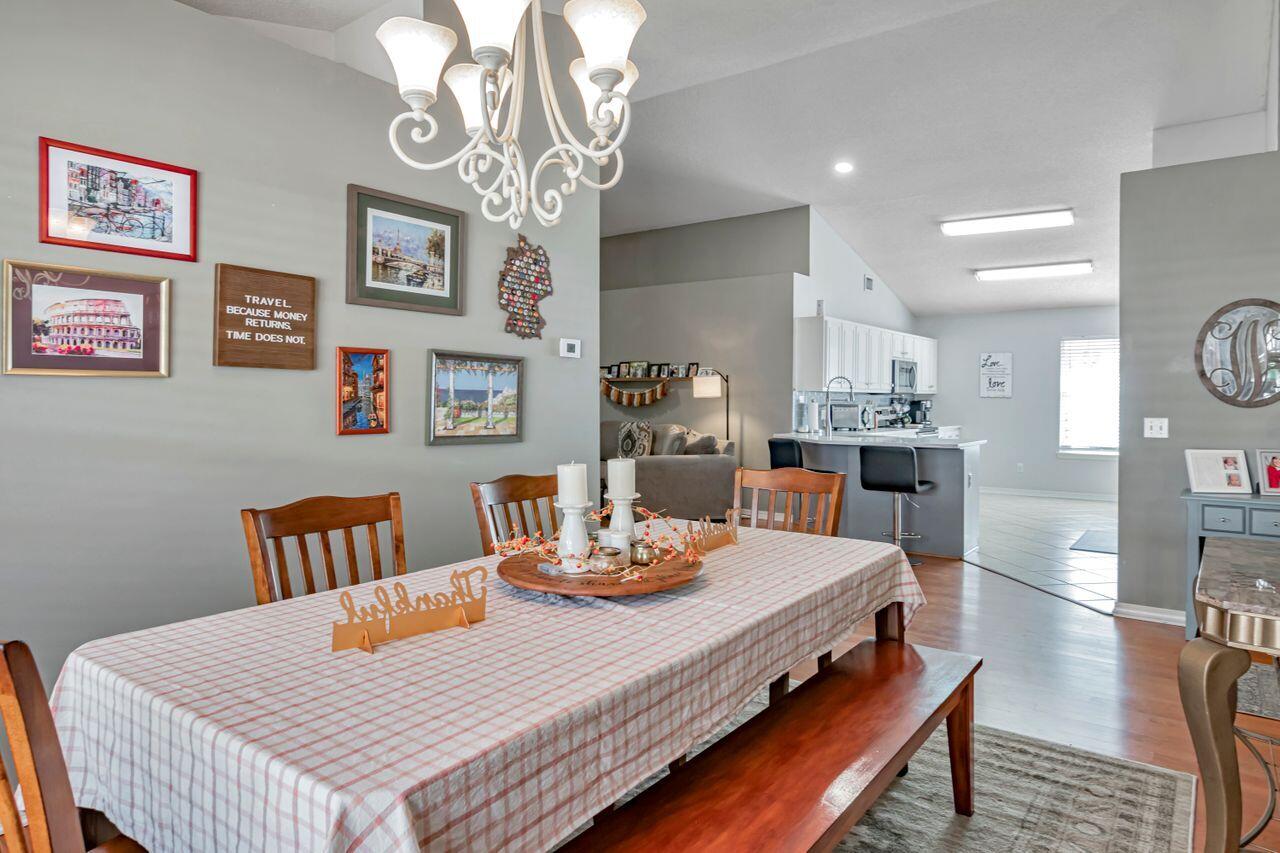 9761 Leeward Way Navarre, FL 32566 - Photo 18 of 43 a view of a dining room with furniture