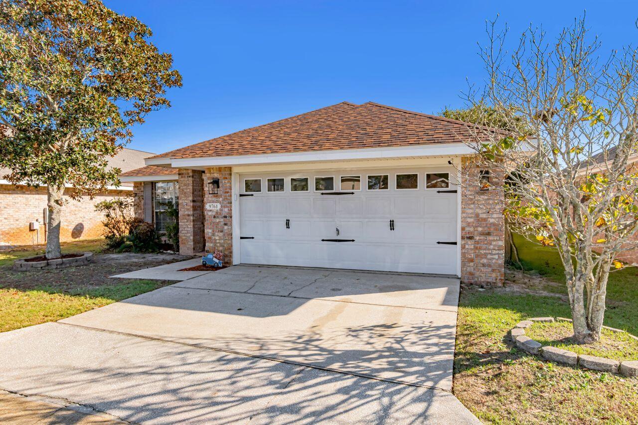 9761 Leeward Way Navarre, FL 32566 - Photo 2 of 43 a view of a house with a yard