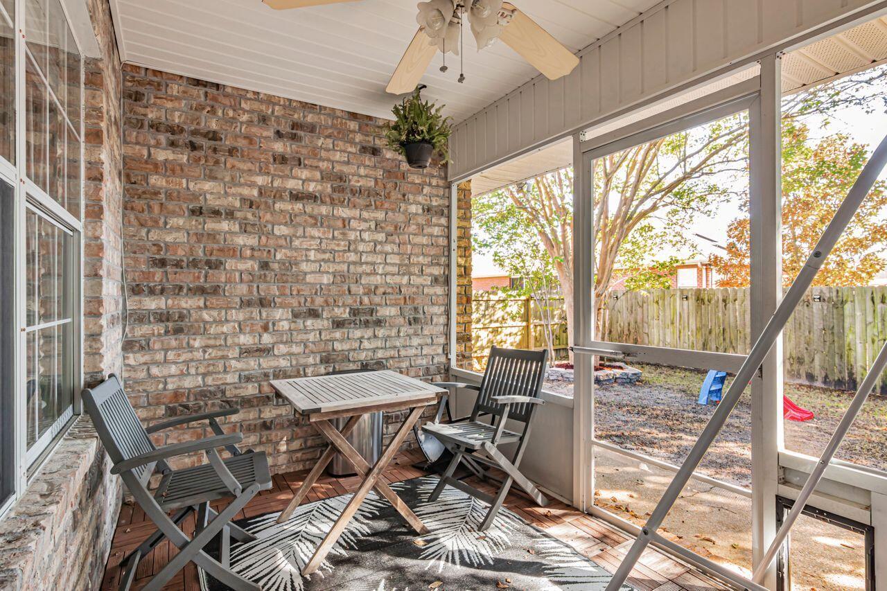 9761 Leeward Way Navarre, FL 32566 - Photo 32 of 43 a view of a dining room with furniture window and outside view