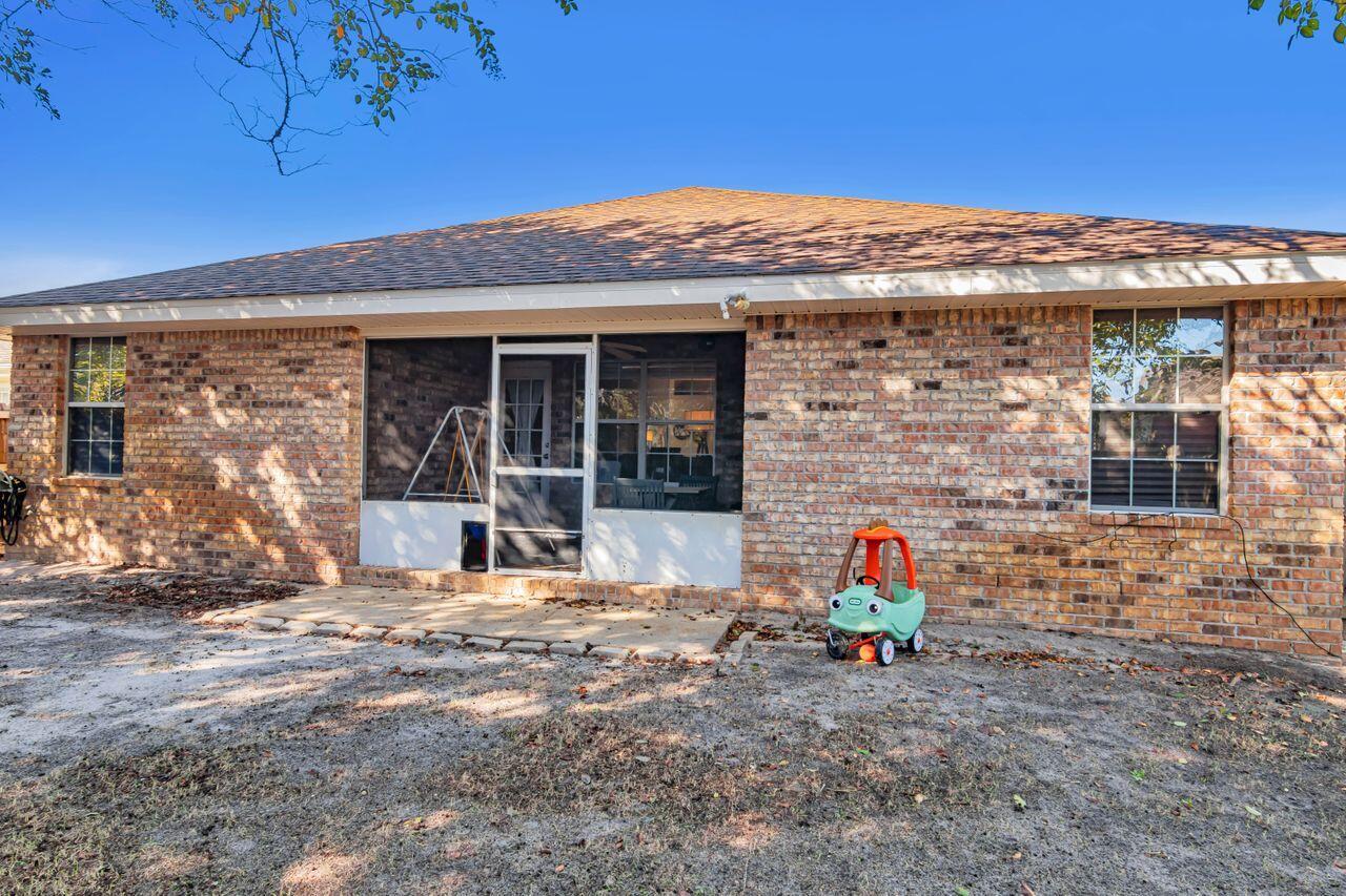 9761 Leeward Way Navarre, FL 32566 - Photo 37 of 43 a view of a house with outdoor space