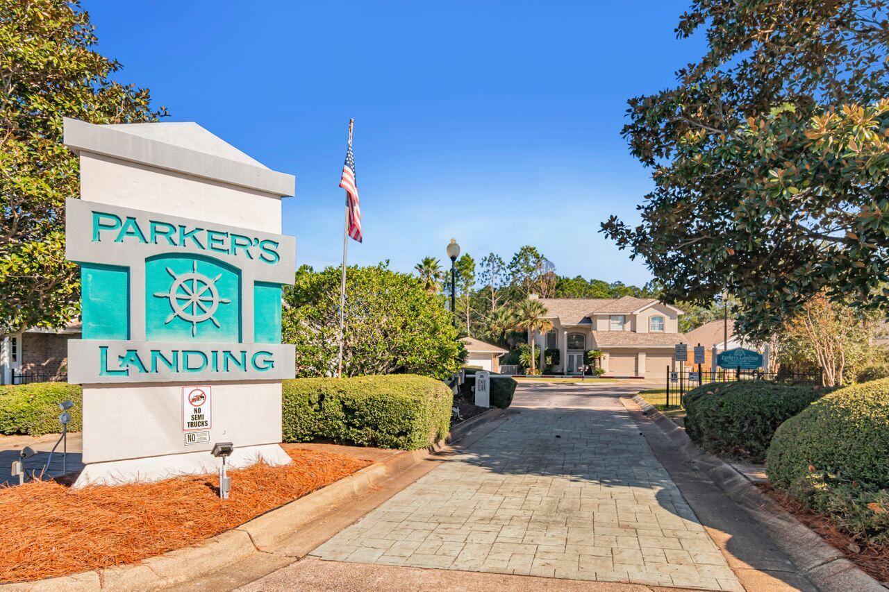 9761 Leeward Way Navarre, FL 32566 - Photo 41 of 43 a sign board with buildings in the background