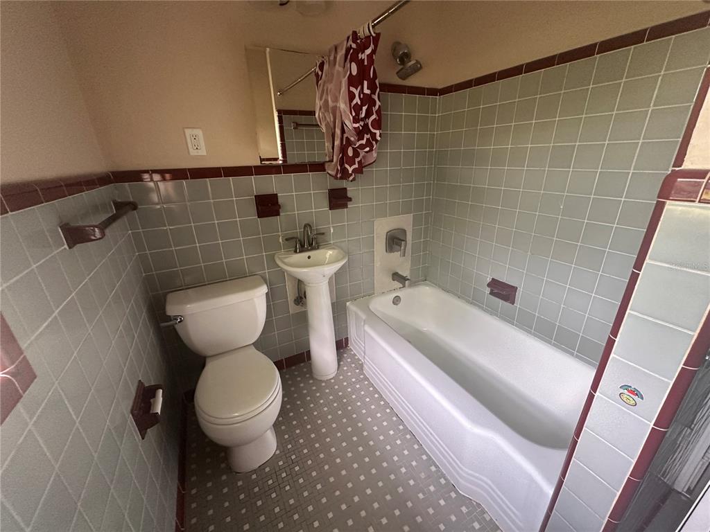 608 Southeast 30th Avenue Ocala, FL 34471 - Photo 7 of 10 a bathroom with a sink toilet and shower