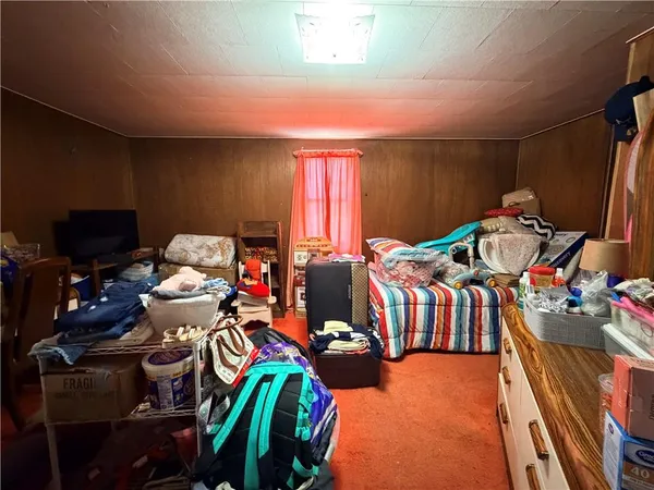 a bedroom with furniture and a view of bedroom