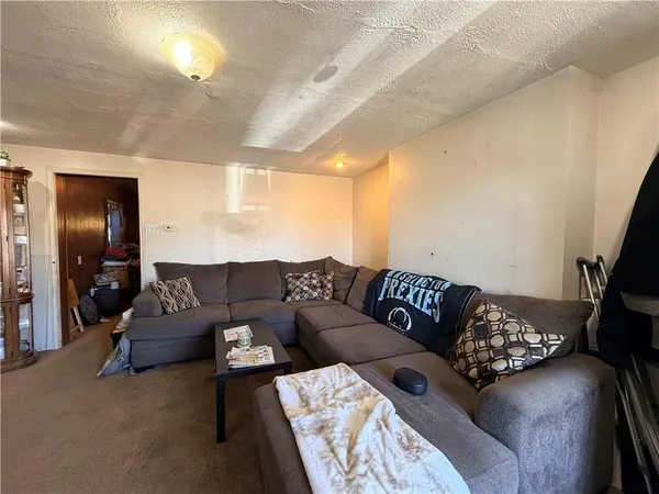 a living room with a couch and a flat screen tv