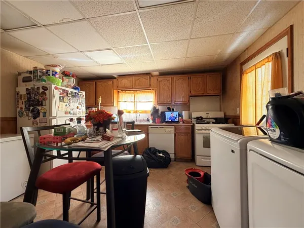 a living room with lots of furniture and appliances