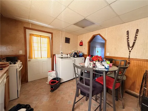a view of a dining room with furniture window and outside view
