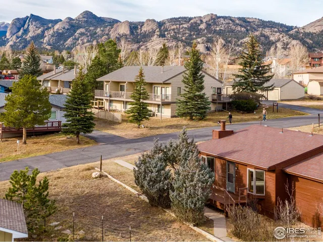a aerial view of a house with a yard