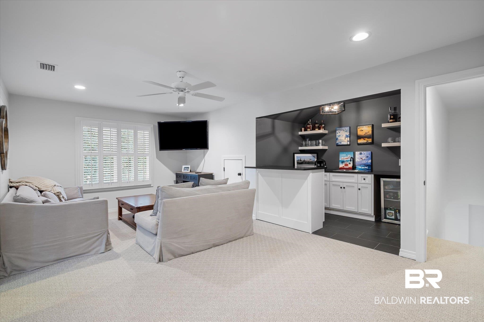 3713 Old Shell Road Mobile, AL 36608 - Photo 35 of 52 Carpeted living room with ceiling fan and bar