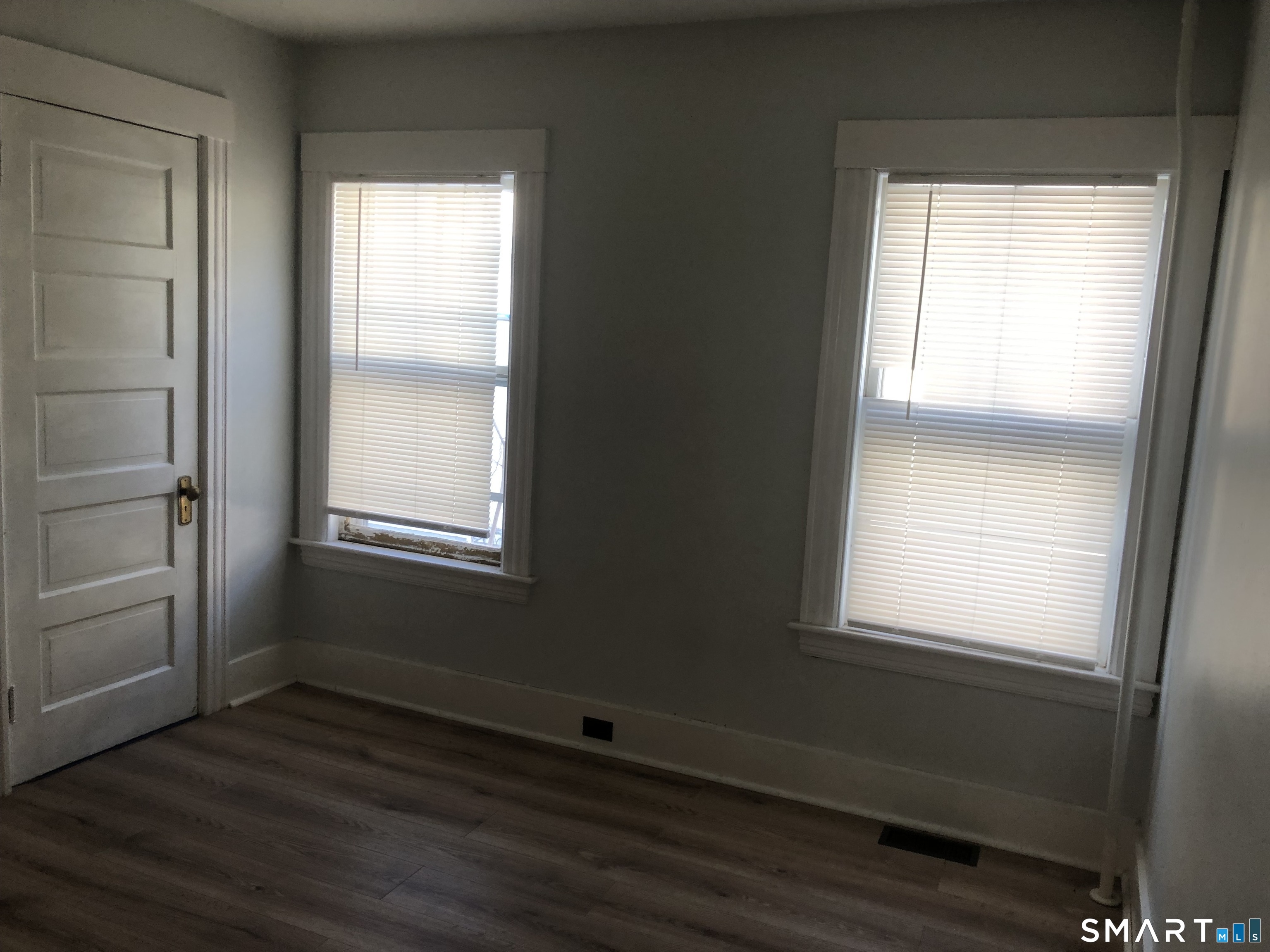37 Sherman Street Bristol, CT 06010 - Photo 14 of 22 a view of an empty room with wooden floor and a window