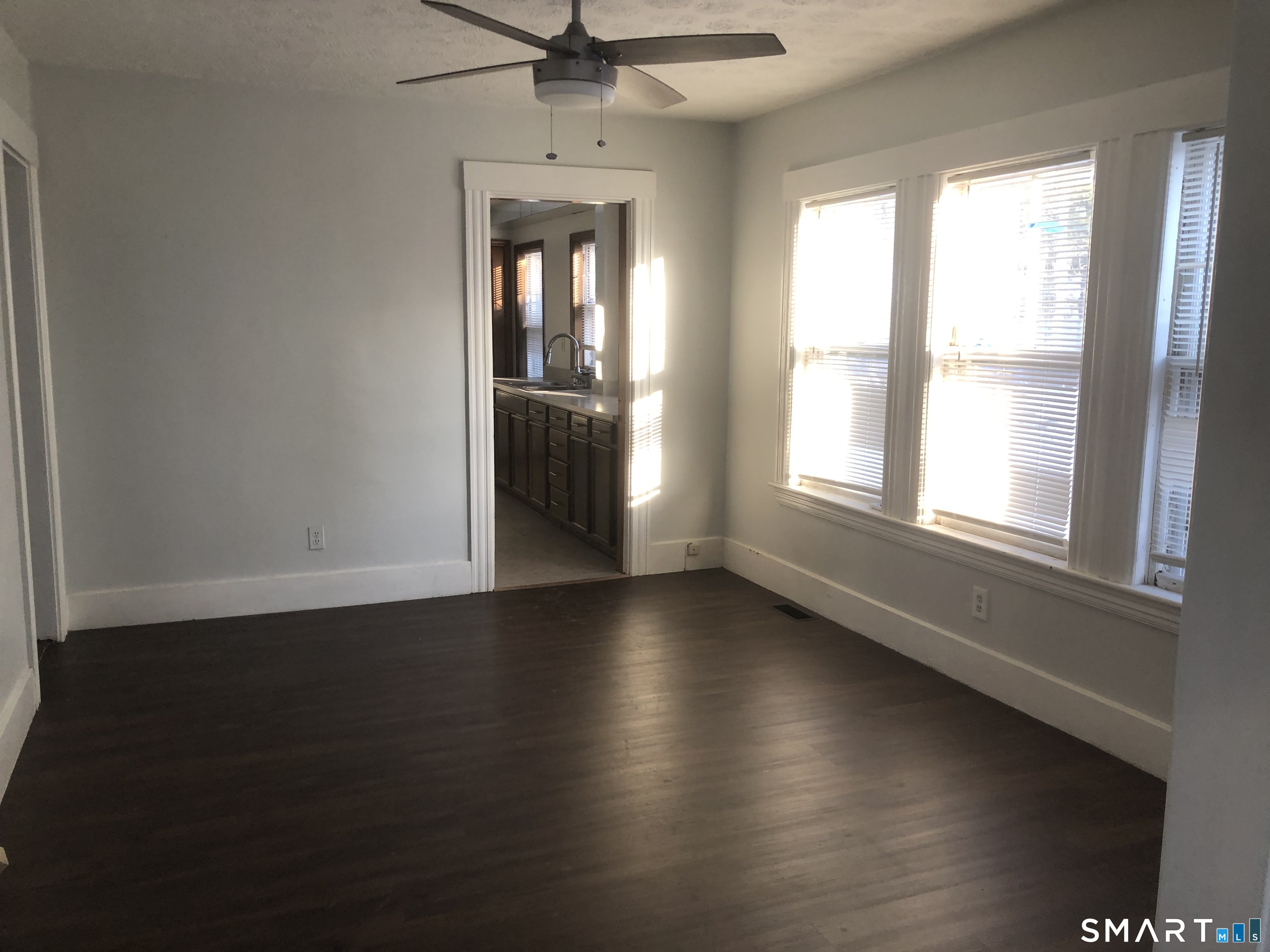 37 Sherman Street Bristol, CT 06010 - Photo 17 of 22 an empty room with wooden floor fan and windows