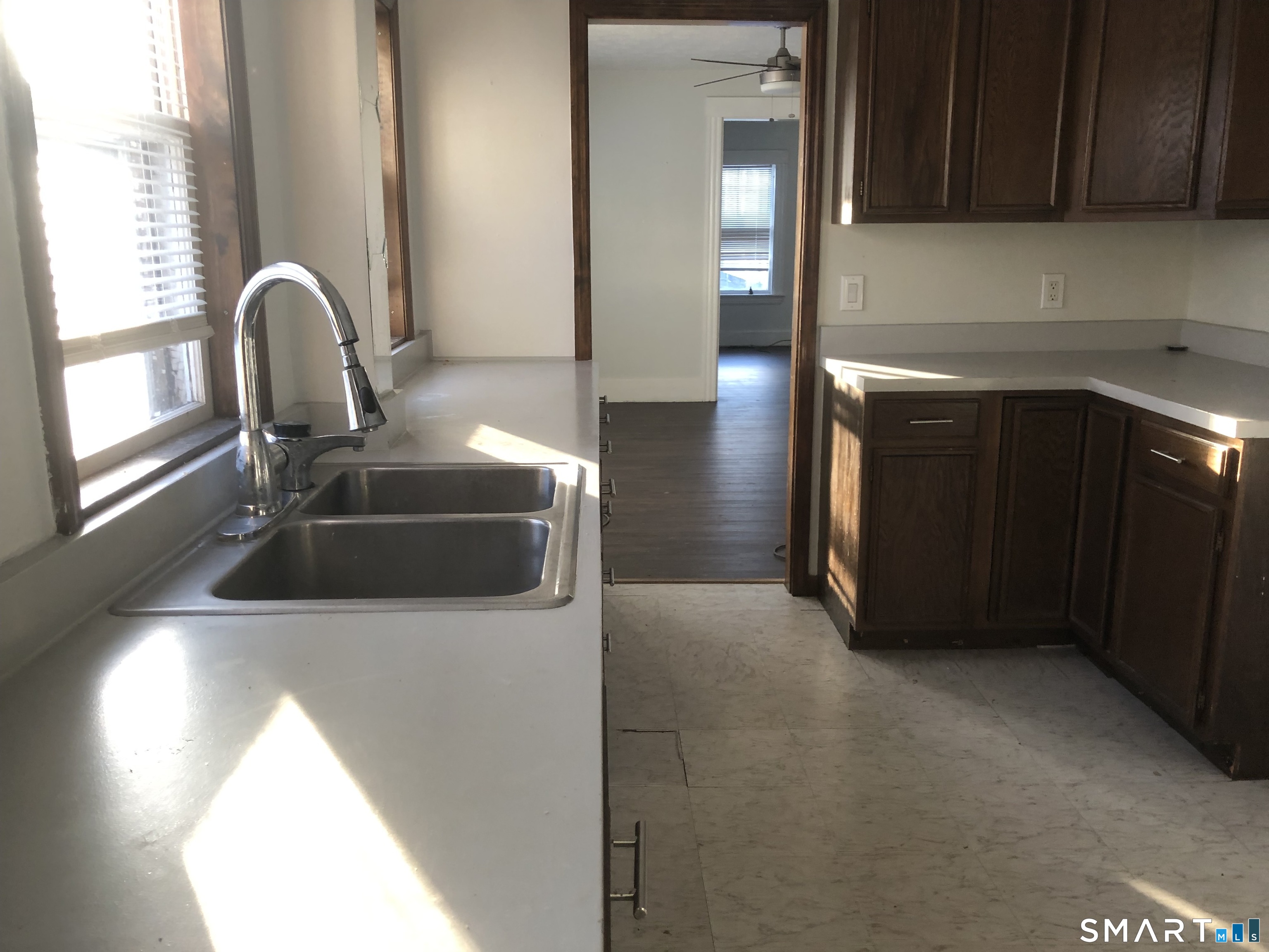 37 Sherman Street Bristol, CT 06010 - Photo 7 of 22 a kitchen with a sink and a microwave