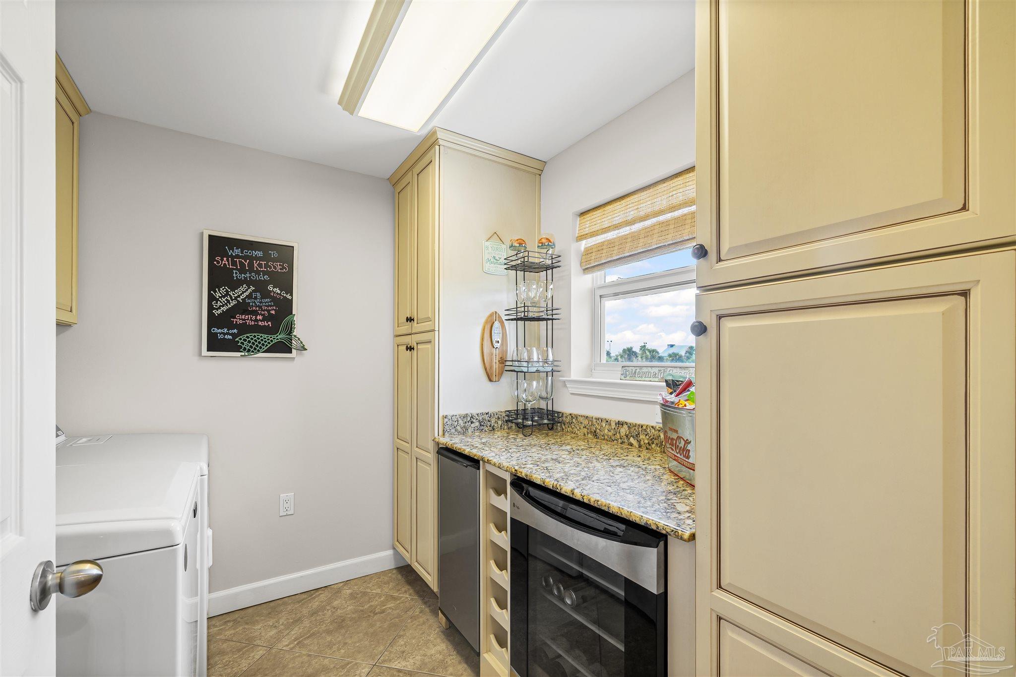 1299 Fort Pickens Road, Unit 10 Pensacola Beach, FL 32561 - Photo 14 of 58 a bathroom with a granite countertop sink and a mirror