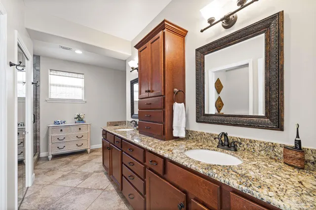a bathroom with a bathtub and a window