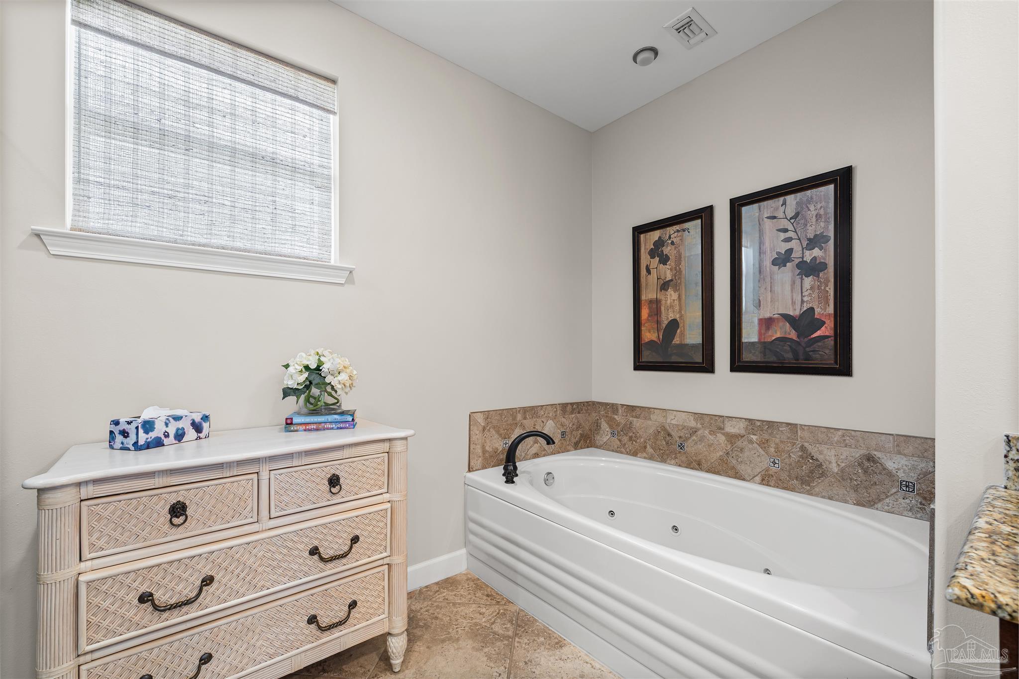 1299 Fort Pickens Road, Unit 10 Pensacola Beach, FL 32561 - Photo 23 of 58 a bathroom with a bathtub and a window