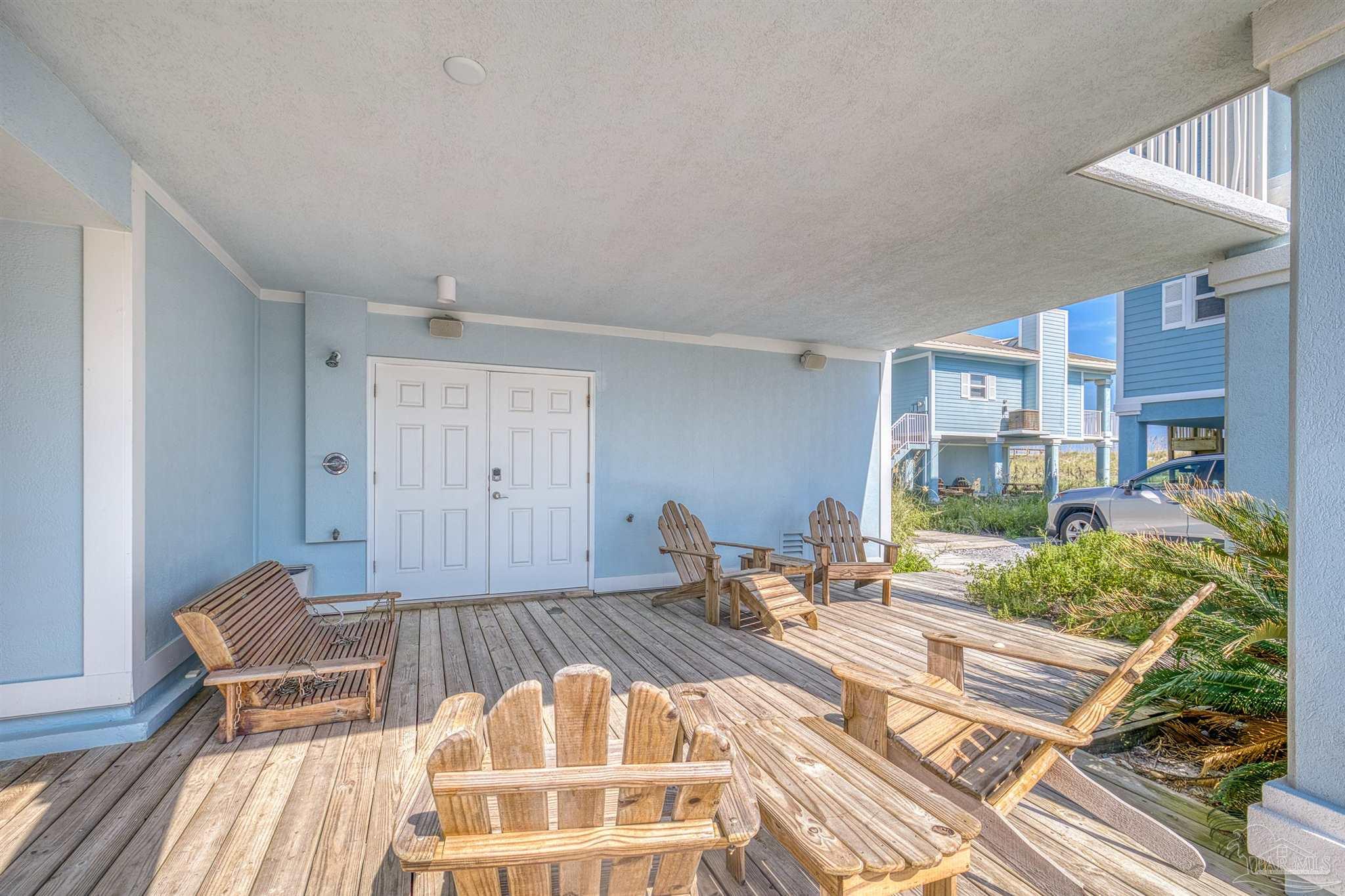 1299 Fort Pickens Road, Unit 10 Pensacola Beach, FL 32561 - Photo 30 of 58 a bed room with a bed and balcony view