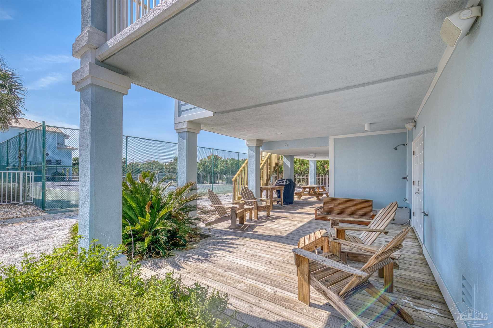 1299 Fort Pickens Road, Unit 10 Pensacola Beach, FL 32561 - Photo 40 of 58 a view of a patio with plants and chairs