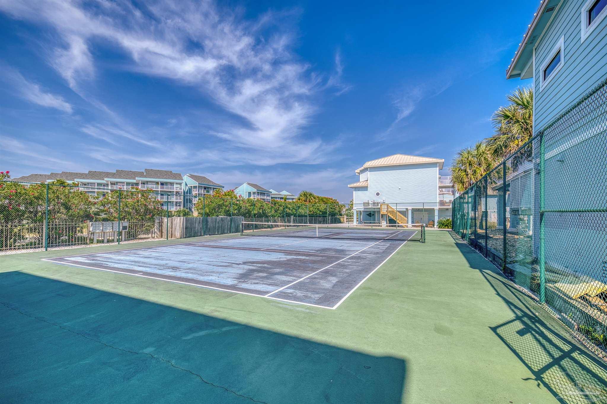 1299 Fort Pickens Road, Unit 10 Pensacola Beach, FL 32561 - Photo 47 of 58 a view of a backyard