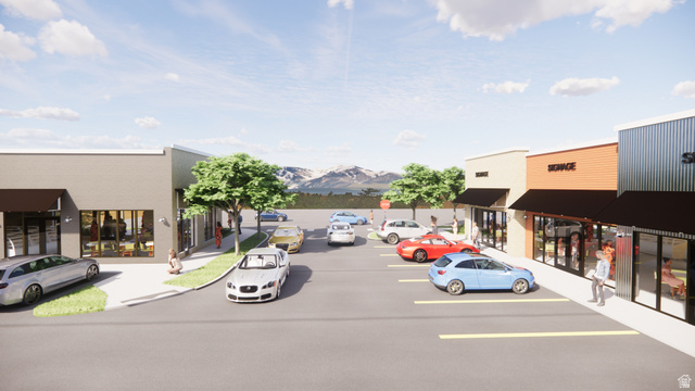 8475 South State Street Sandy, UT 84070 - Photo 2 of 31 Uncovered parking lot featuring a mountain view