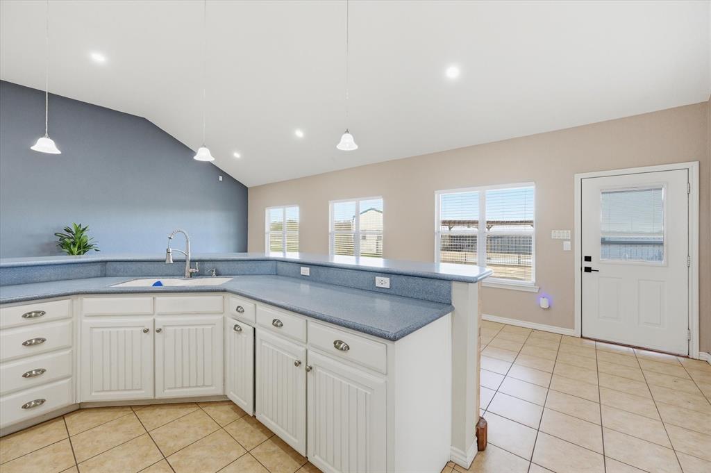1616 Nash-Howard Road Waxahachie, TX 75165 - Photo 11 of 36 a kitchen with a sink and cabinets