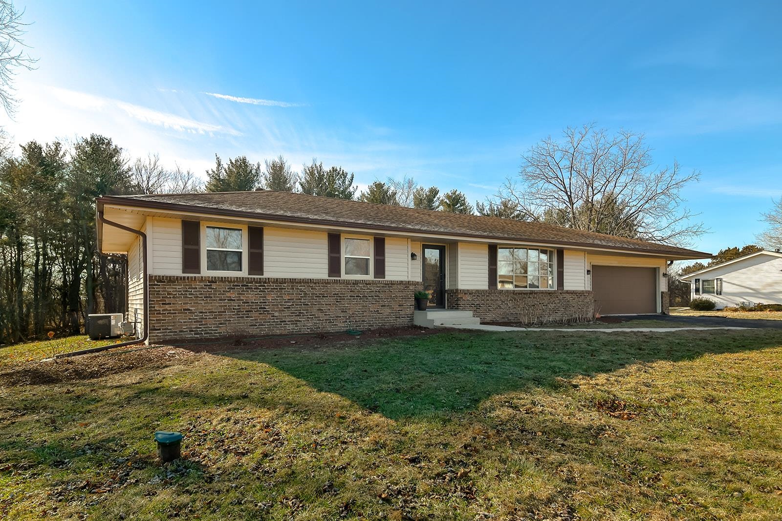 a front view of a house with a yard