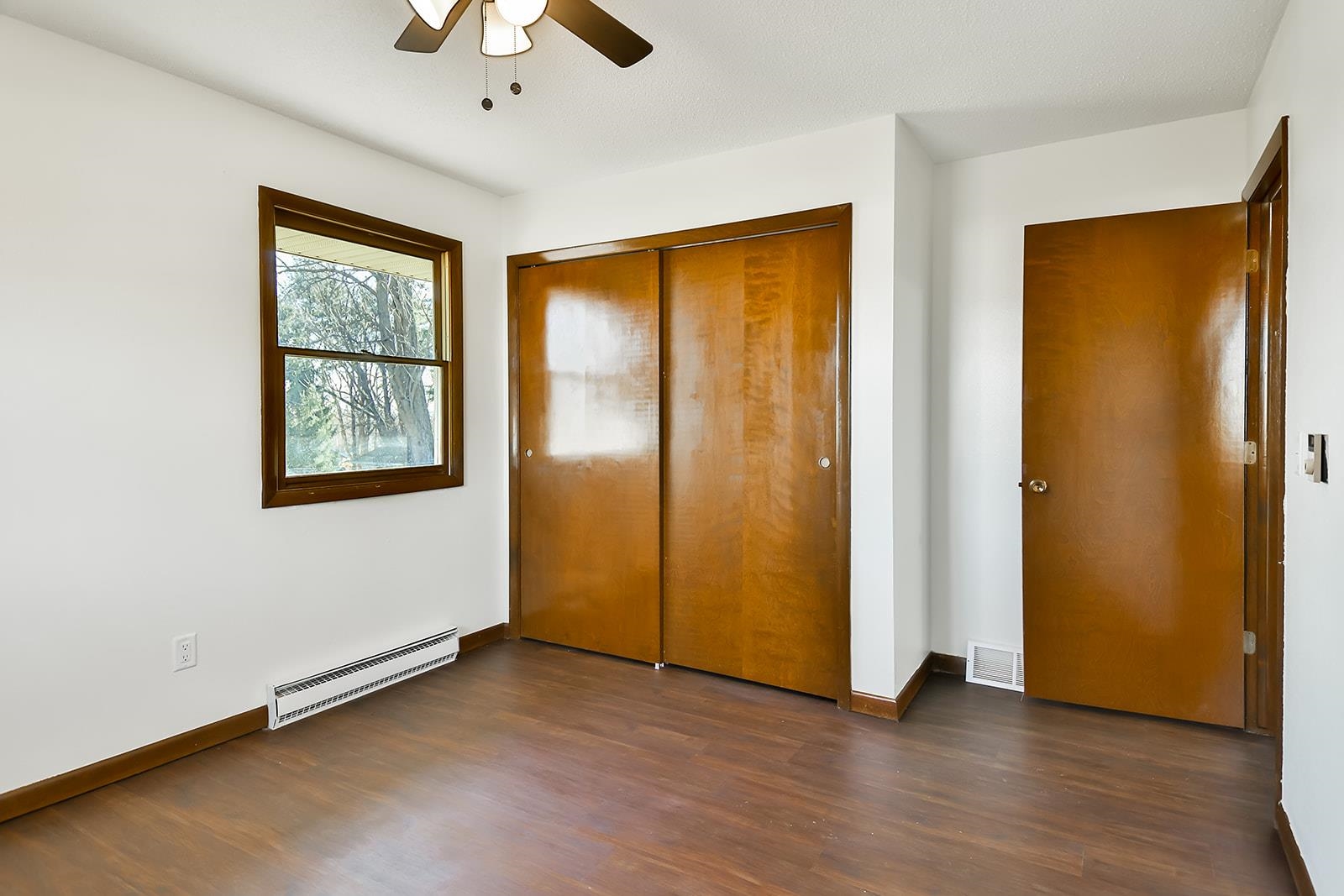 8567 Valley View Drive Stillman Valley, IL 61084 - Photo 14 of 36 a view of an empty room with a window and wooden floor