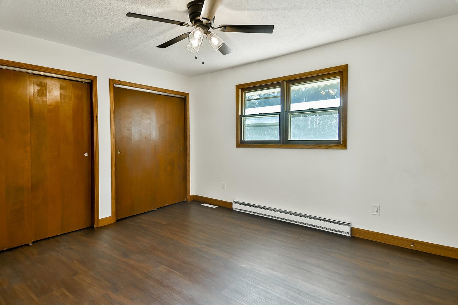8567 Valley View Drive Stillman Valley, IL 61084 - Photo 17 of 36 a view of an empty room with a window and wooden floor