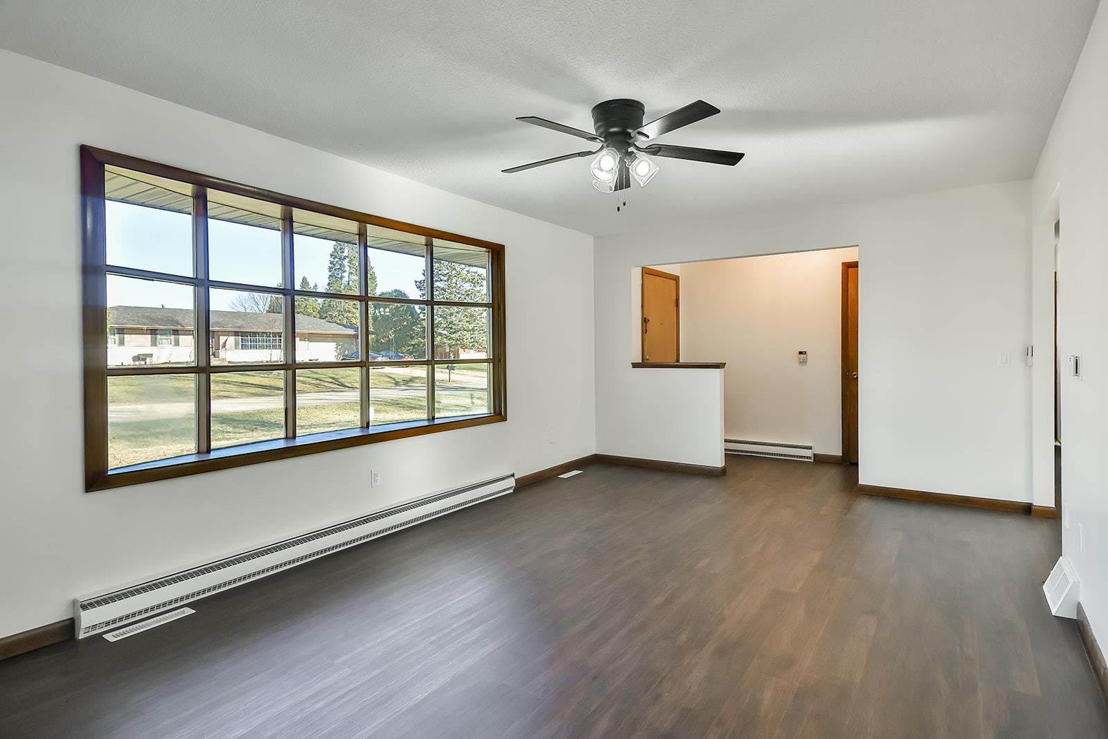 8567 Valley View Drive Stillman Valley, IL 61084 - Photo 31 of 36 a view of an empty room with a window and wooden floor