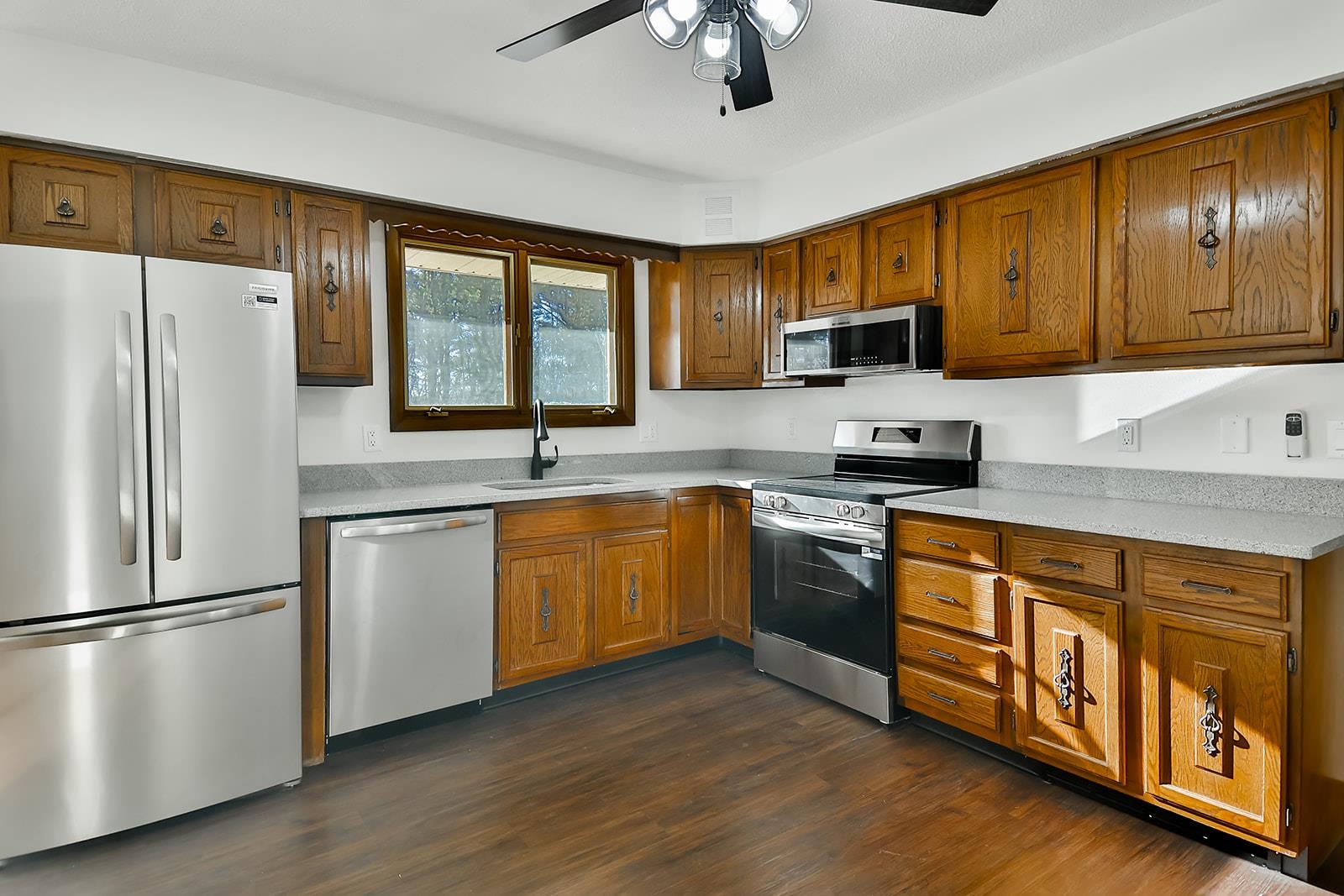 8567 Valley View Drive Stillman Valley, IL 61084 - Photo 36 of 36 a kitchen with stainless steel appliances granite countertop a refrigerator stove top oven and sink
