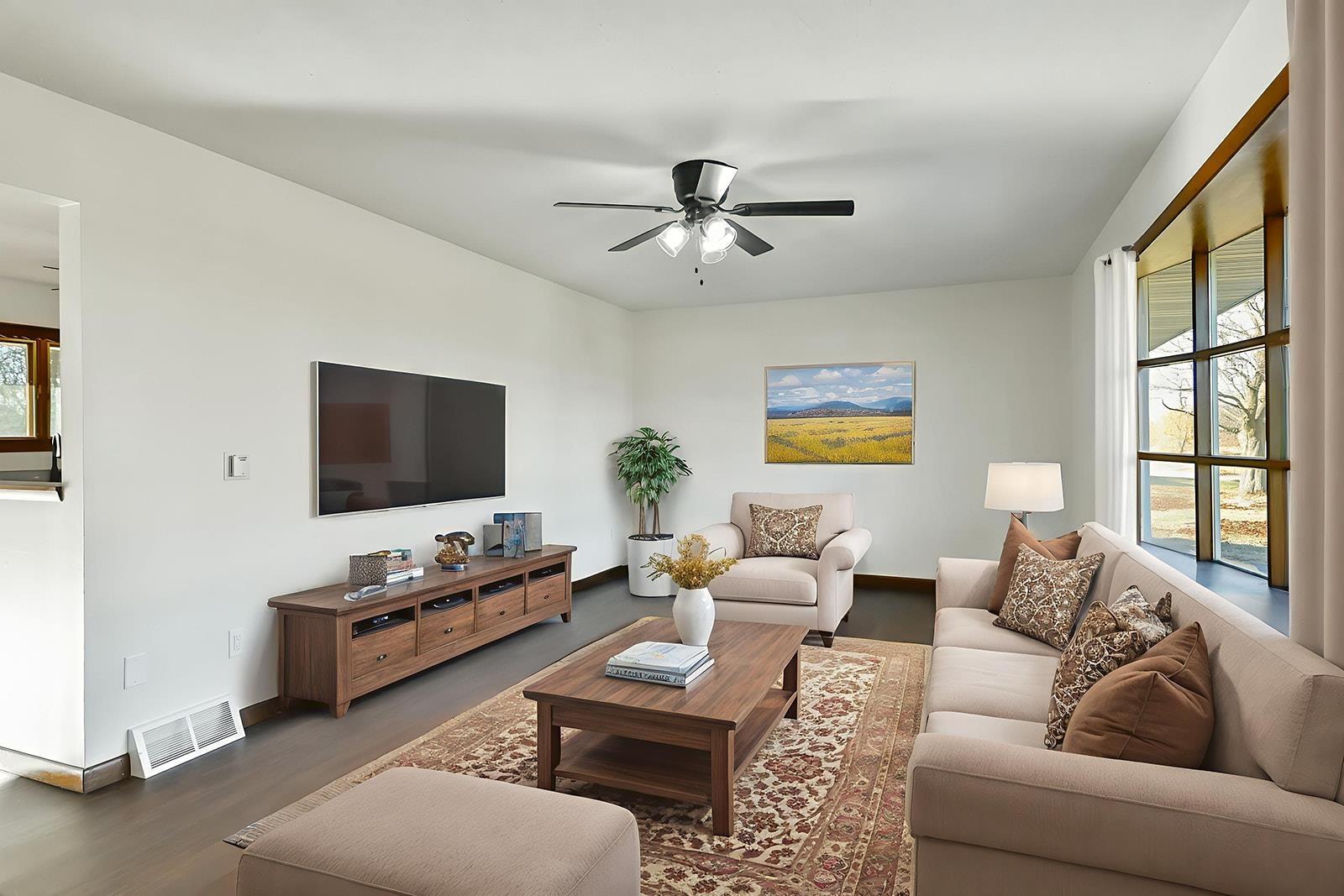 8567 Valley View Drive Stillman Valley, IL 61084 - Photo 4 of 36 a living room with furniture and a flat screen tv