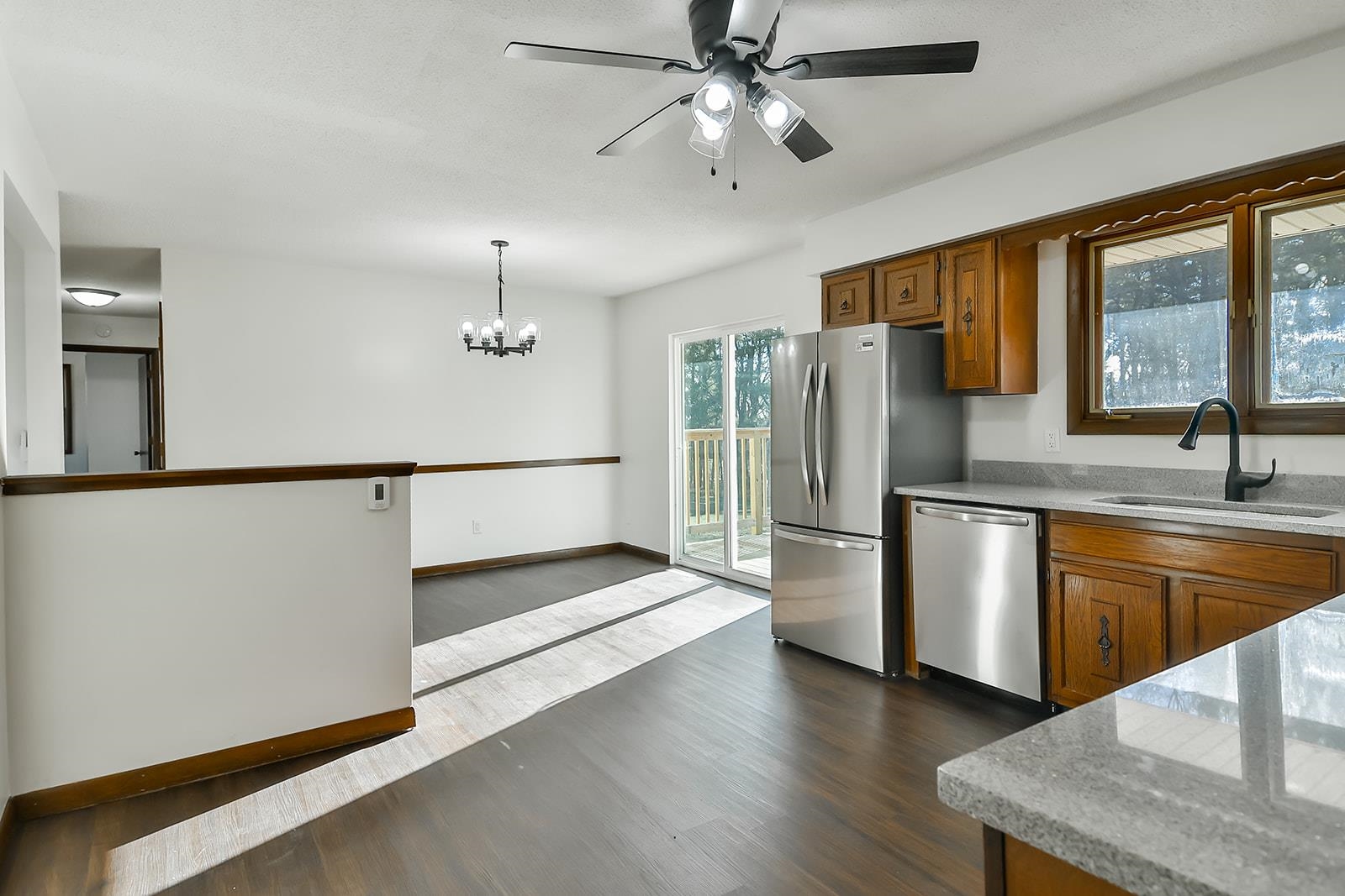 8567 Valley View Drive Stillman Valley, IL 61084 - Photo 7 of 36 a kitchen with stainless steel appliances granite countertop a refrigerator a sink and a stove