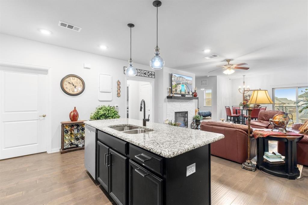 651 Watters Road, Unit 5205 Allen, TX 75013 - Photo 6 of 31 a kitchen with a table and chairs in it