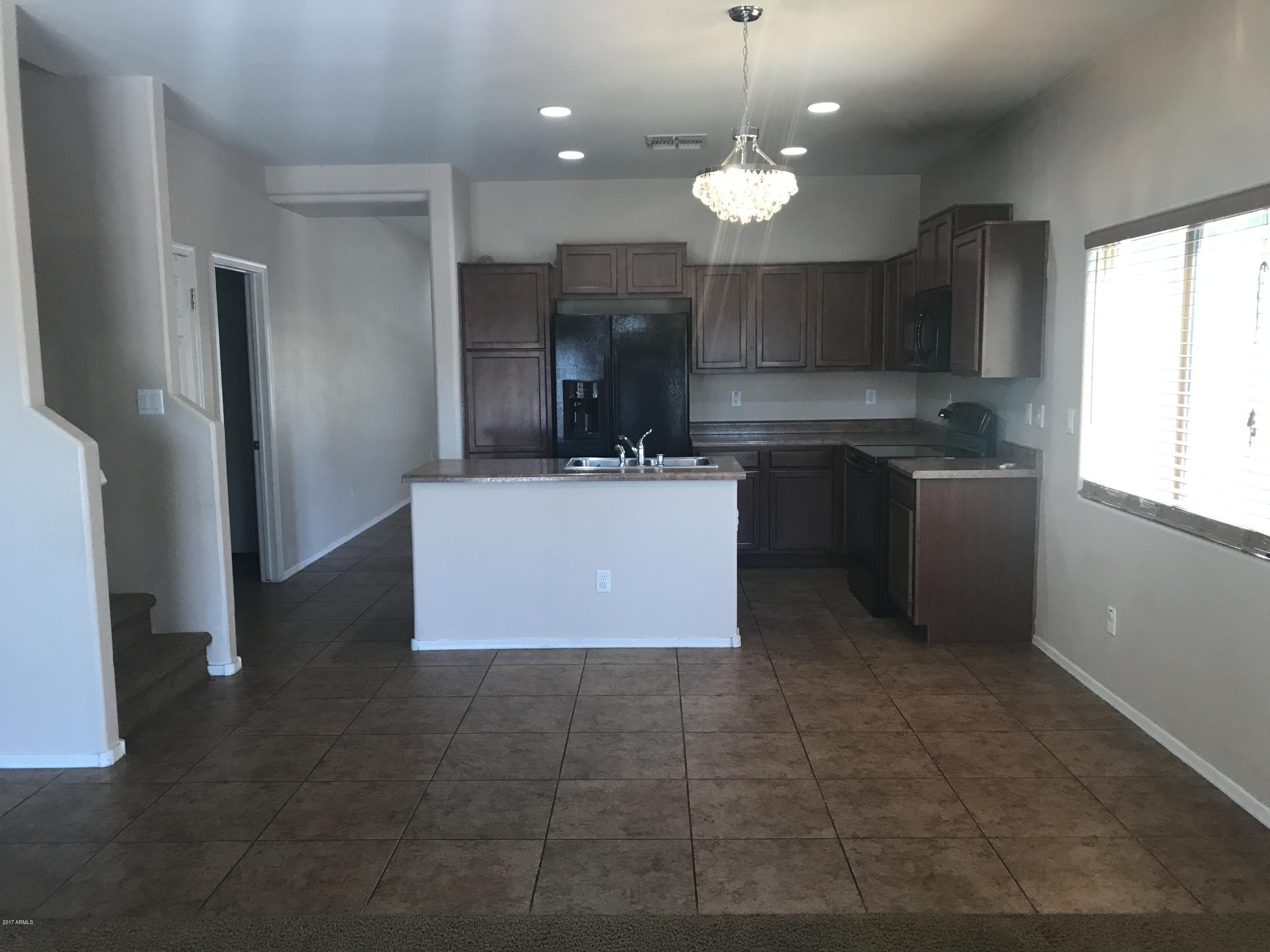 43472 West Magnolia Road Maricopa, AZ 85138 - Photo 8 of 33 Family Room to Kitchen