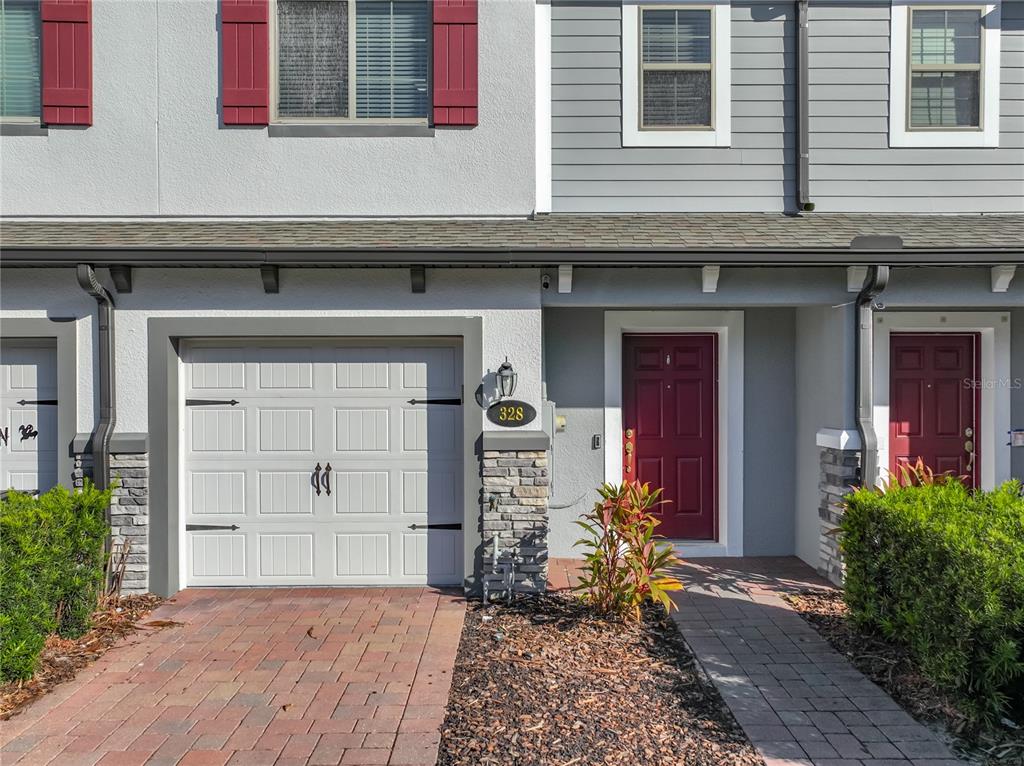 a front view of a house with a lots of windows